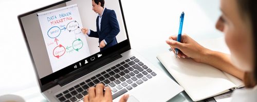 Woman Participating In Online Coaching Session Using Laptop