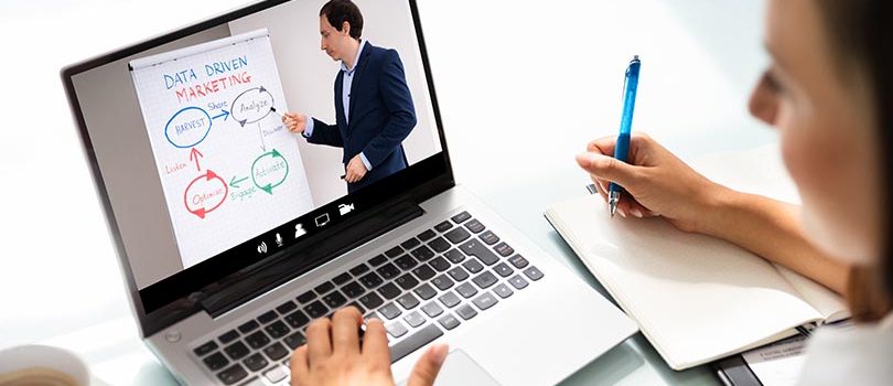 Woman Participating In Online Coaching Session Using Laptop