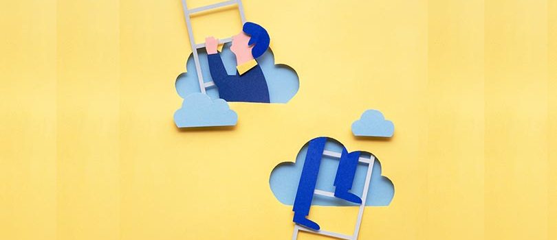 Climbing up. Creative concept photo of man climbing ladder made of paper on yellow background.