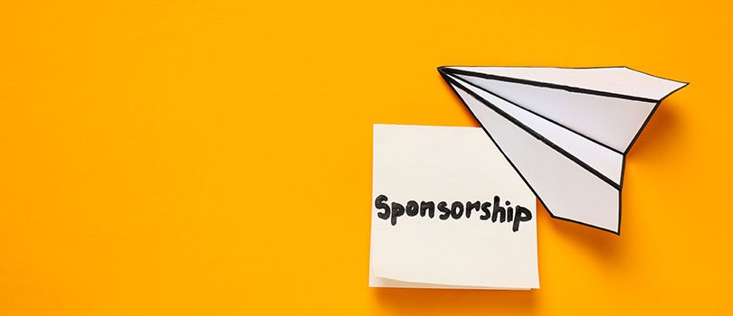 Concept of sponsorship with paper plane on yellow background Concept of sponsorship with paper plane on yellow background
