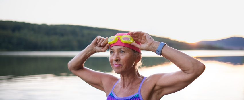 Portrait,Of,Active,Senior,Woman,Swimmer,Outdoors,By,Lake. Portrait,Of,Active,Senior,Woman,Swimmer,Outdoors,By,Lake.